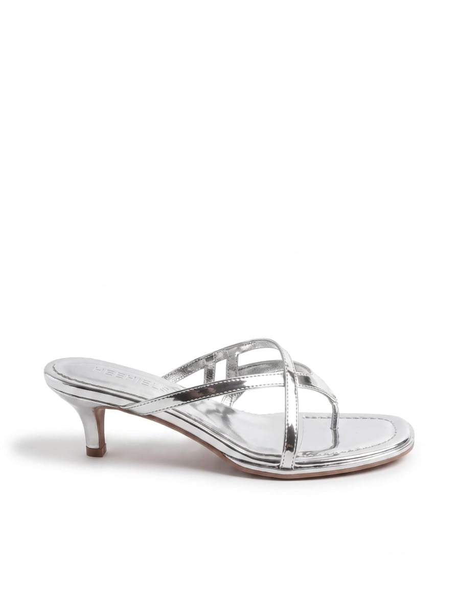 Silver kitten heel sandal with crossover straps and a 4cm heel